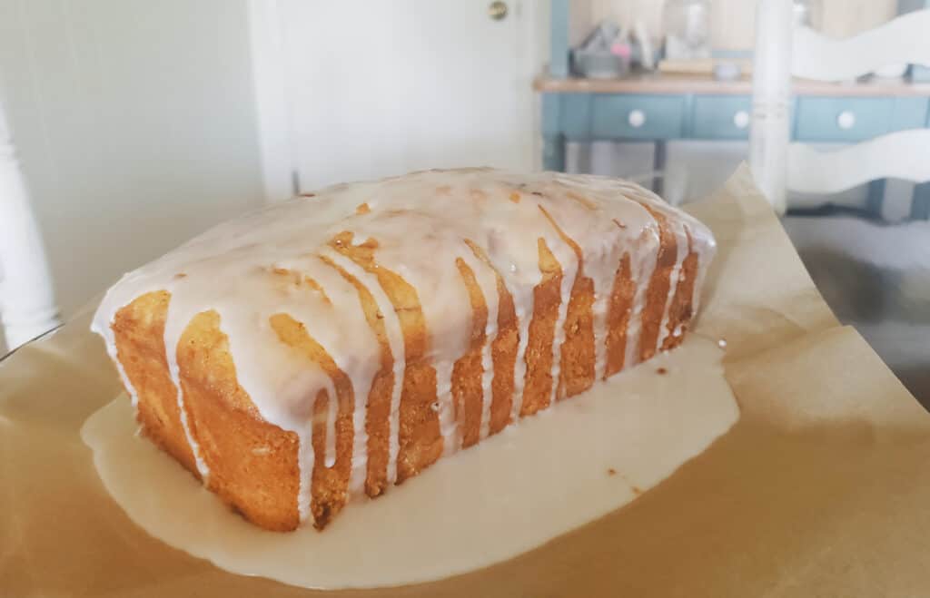 strawberry, lemon pound cake with icing drizzled over it