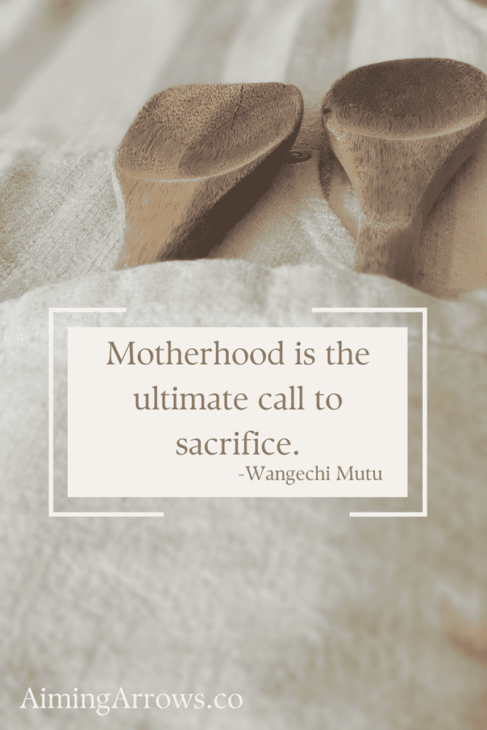 wooden utensils in a kitchen apron pocket, with the quote "Motherhood is the ultimate call to sacrifice" by -Wangechi Mutu
