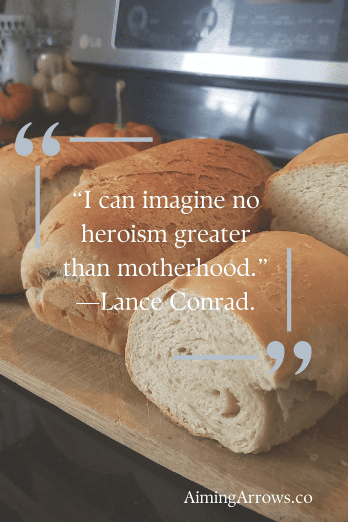 four sourdough sandwich loaves laid on the stovetop with the quote, “I can imagine no heroism greater than motherhood.” 

—Lance Conrad.