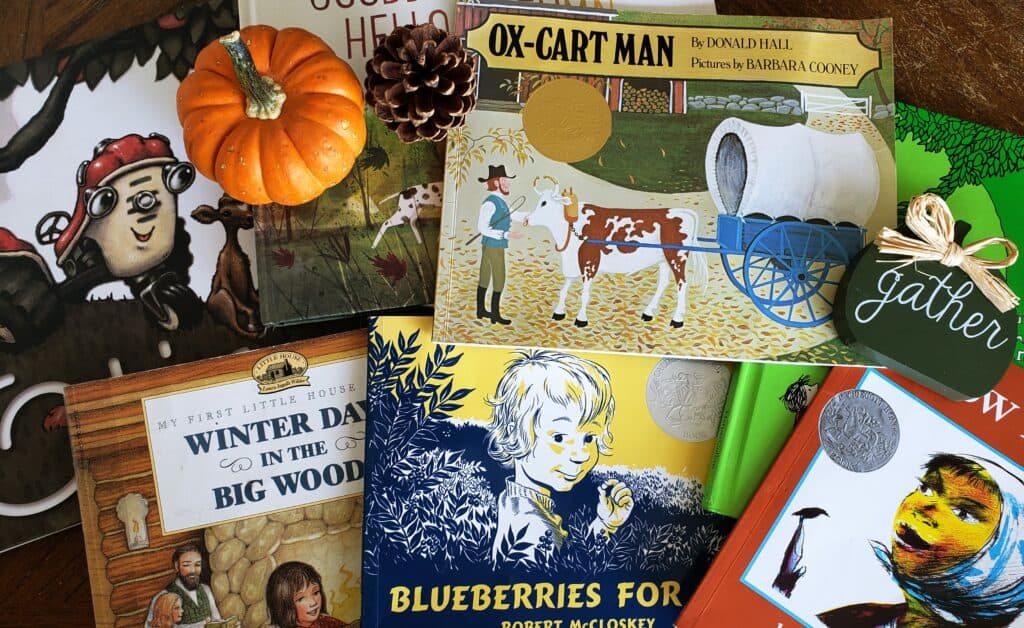 fall books laid out with pumpkins and fall decor